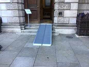 A photograph of a ramp placed over the entrance steps at Burlington House